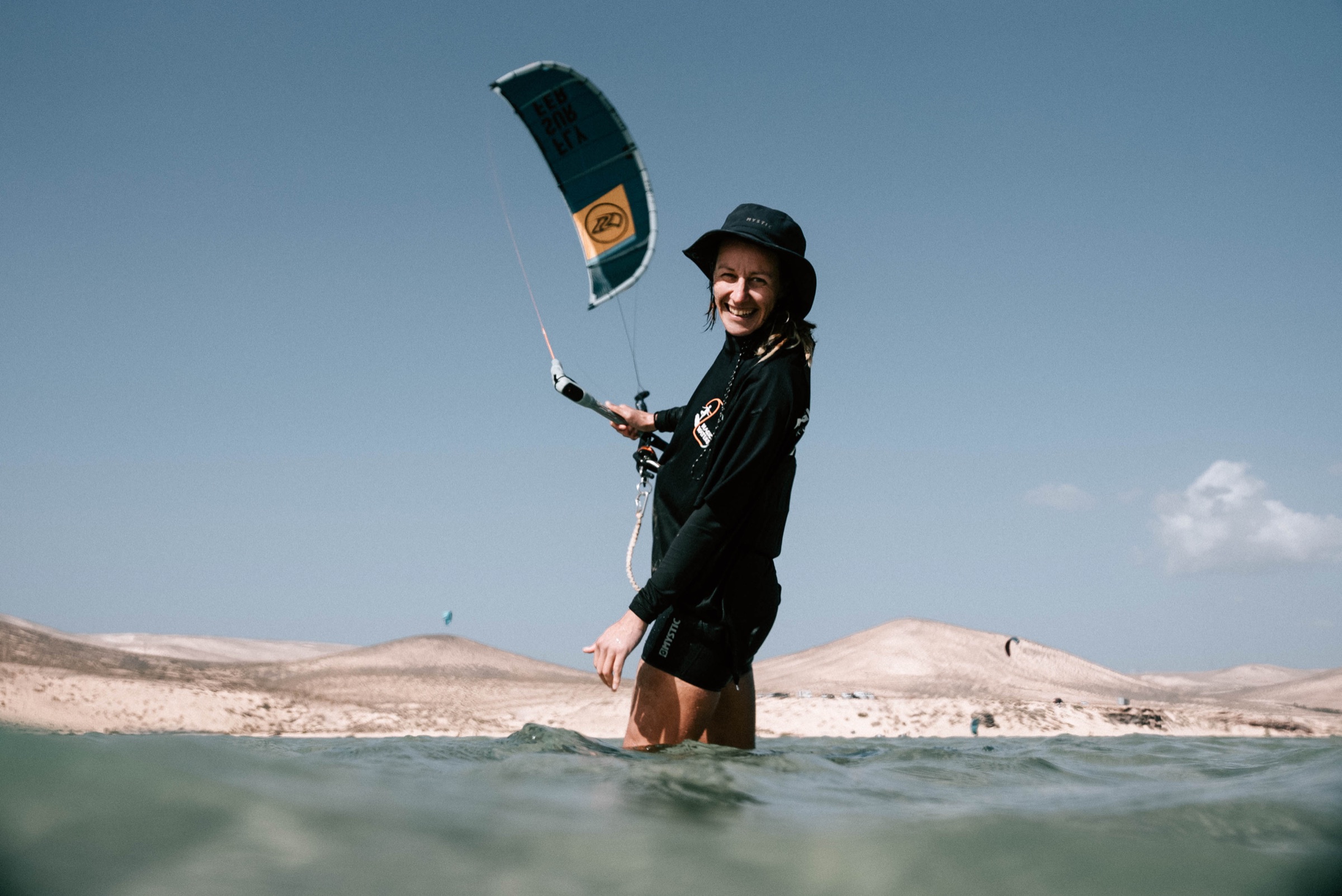 Kitesurfer riding across the water